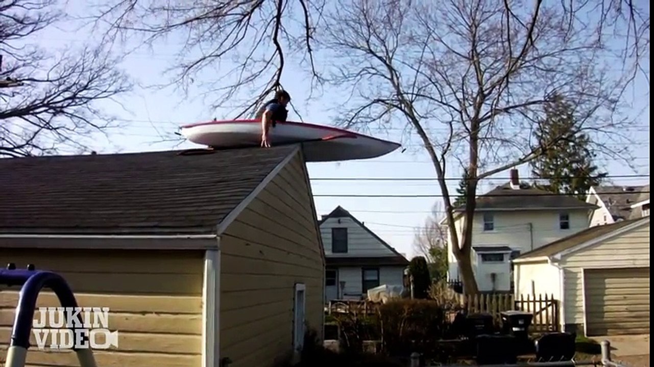Crazy guy jump from roof with boat