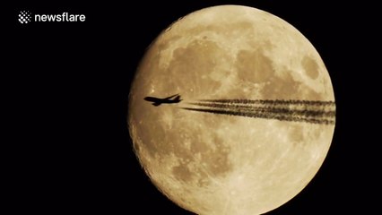 Plane passes in front of the Moon
