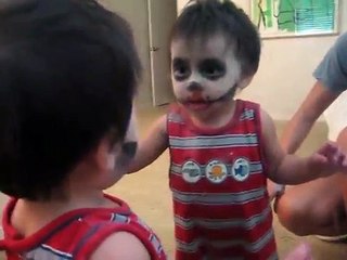 ---Baby Scares himself in the mirror. -