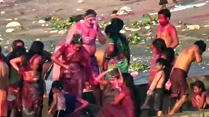 People Bathing In The Ganges River After Playing Holi - fastival of inidan country having  good prayer