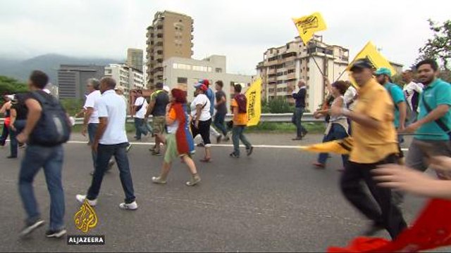 Venezuela protesters clash with riot police in Caracas