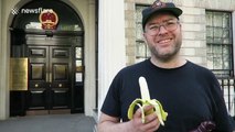 Man eats banana erotically outside Chinese embassy in protest over ban