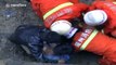 Firefighters dig through clay with bare hands to rescue trapped workers