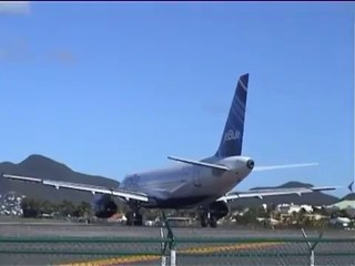Amazing Clip of plane coming close to ground and blowing people into the sea almost!