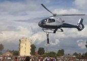 Kenyan Man Takes Hold of Helicopter and Doesn't Let Go