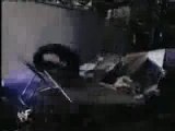 WWE - Undertaker chokeslams RVD off stage through two tables
