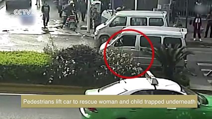 Pedestrians lift car to rescue woman and child trapped underneath