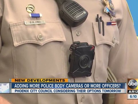 Adding more police body cameras or more officers?