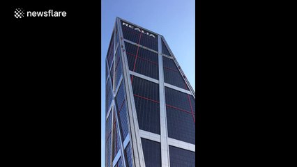 Greenpeace activists climb Madrid building to protest TTIP