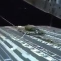 Military airdrops Humvee vehicles with parachutes by night