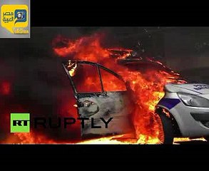 محتجون فرنسيون يضرمون النار في سيارة شرطة