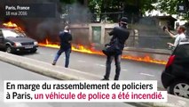 Une voiture de police incendiée en marge de la manifestation à Paris