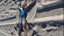 The warm sand on a sea beach.  Gymnastics on the beach | HD