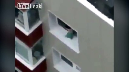 Baby walks along ledge of high rise window in India!