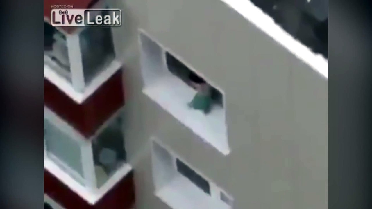Baby walks along ledge of high rise window in India!
