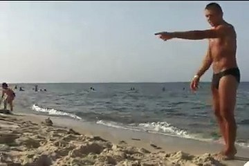 Shooting a bottle right next to my sister´s head on the beach