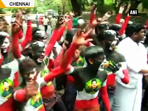 AIADMK supporters celebrate party s lead outside Amma s residence