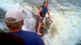 10 year old wakesurfing with a wakeskate