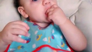 10 months old baby eating pineapple