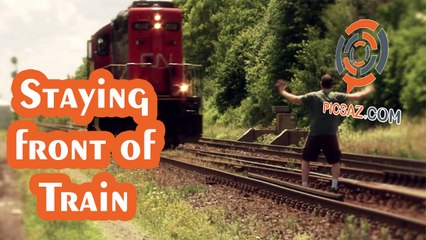This İndian guy risk his life by staying front of Train