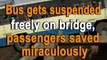 Bus gets suspended freely on bridge, passengers saved miraculously