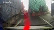 Driver gets out of car to smoke on motorway and narrowly avoids being crushed by lorry