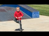 Two Skater Dudes Play With Scooter Kid at the Skatepark