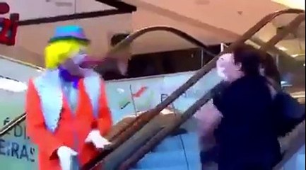 Clown Throws Pie at Women On Escalator
