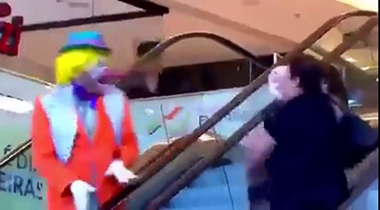 Clown Throws Pie at Women On Escalator