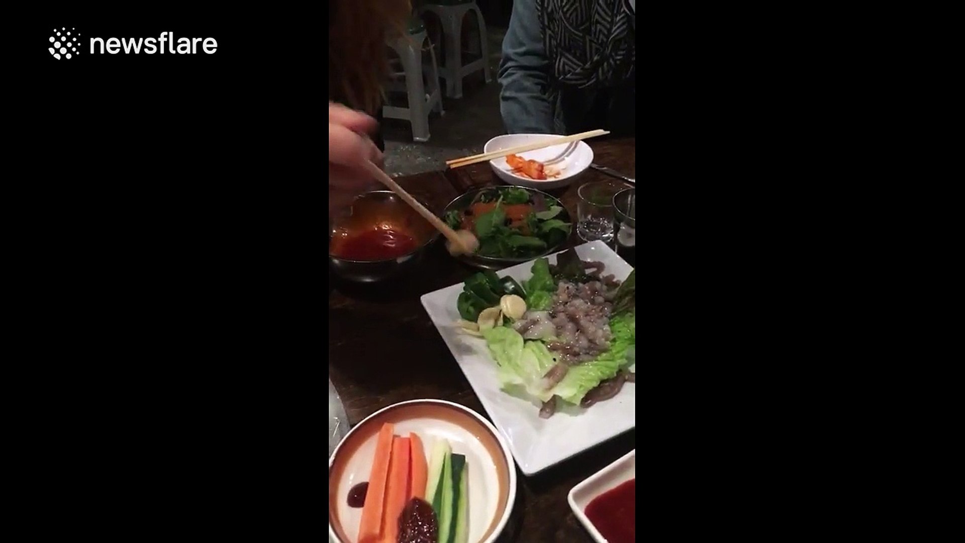 ⁣Student eats 'live' octopus