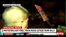 Protesters break through barriers, light fires, throw rocks outside Trump rally in Albuquerque, NM.1