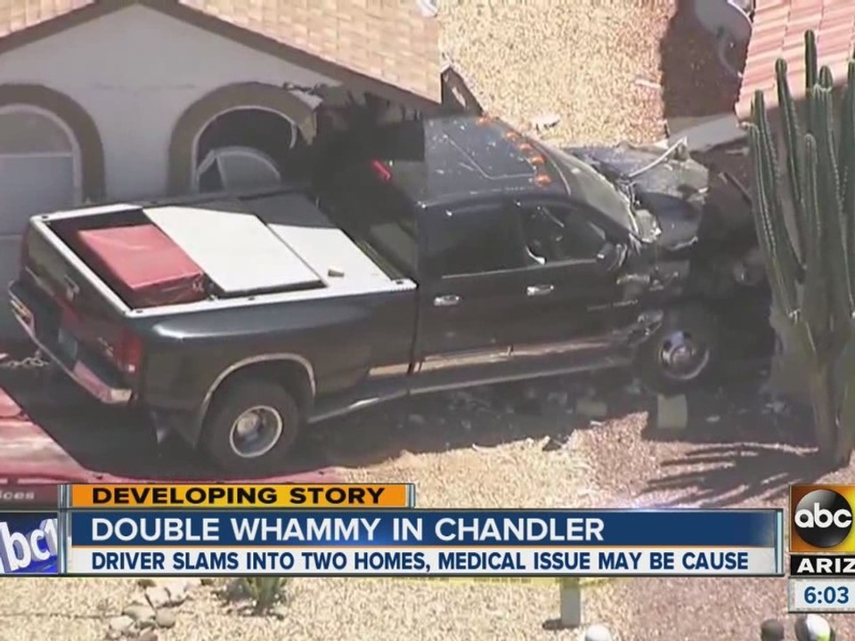 Driver crashes into 2 houses