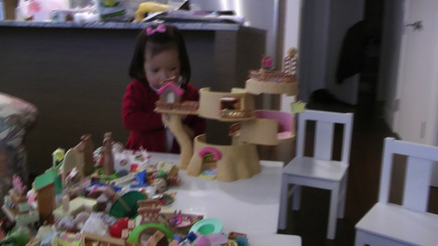 Girl Playing Sylvanian Families Baby Tree House