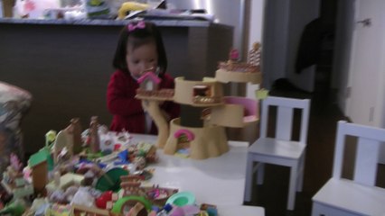Girl Playing Sylvanian Families Baby Tree House