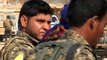 Soldados americanos e combatentes curdos contra o EI