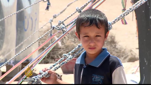 Confronting Isil: Hundreds flee city of Fallujah