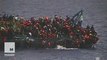 Italian Navy rescues 500 migrants forced to jump off capsized boat
