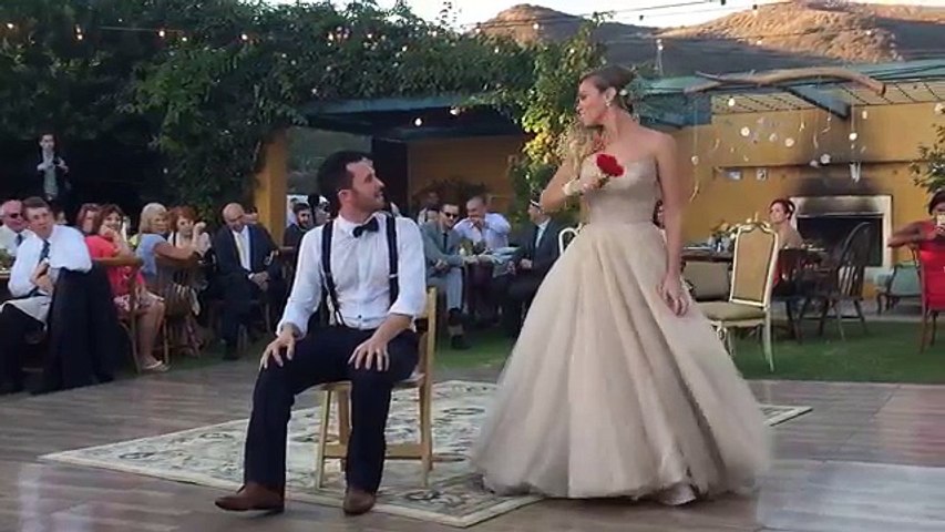 Bride puts a spell on her magician groom during first dance