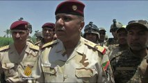 Iraqi forces surround Fallujah as they push to drive out ISIL