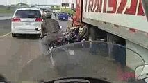 Motorcyclist gets run over by Semi and survives