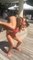 Chick In A Bikini Shows Off Her Perfect Form While Squatting Her Friend  New Video