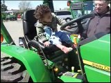 kid jake rides a tractor [19 m0 3 22 09]
