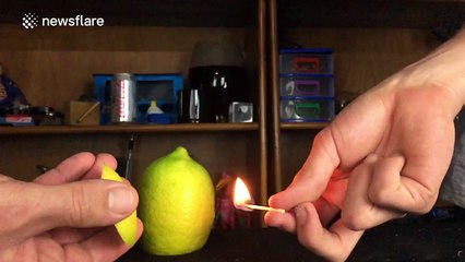 Slow-motion footage of a lemon creating a ball of fire
