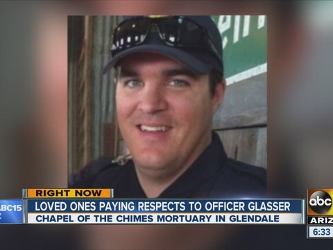 Loved ones paying respects to Officer Glasser