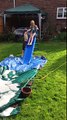 Slow motion video going down back garden water slide