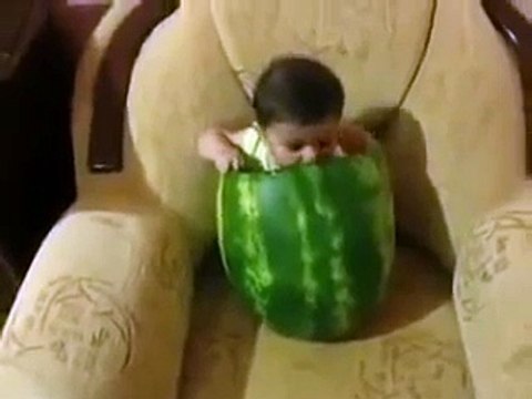 funny baby eating watermelon in a very very funny style