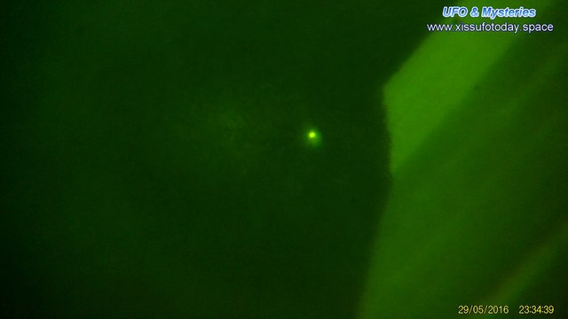 Bright UFO flying above the clouds