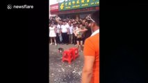 Man smashes bottles over his head to show how strong he is