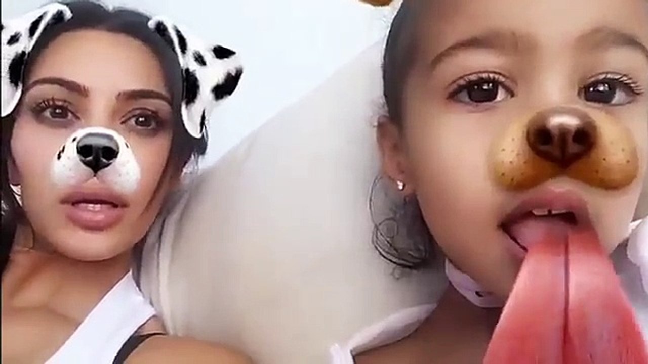 Kim Kardashian and North playing with snapchat effetcts