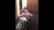 Cute Toddler Dances Beside Vacuum as It Operates